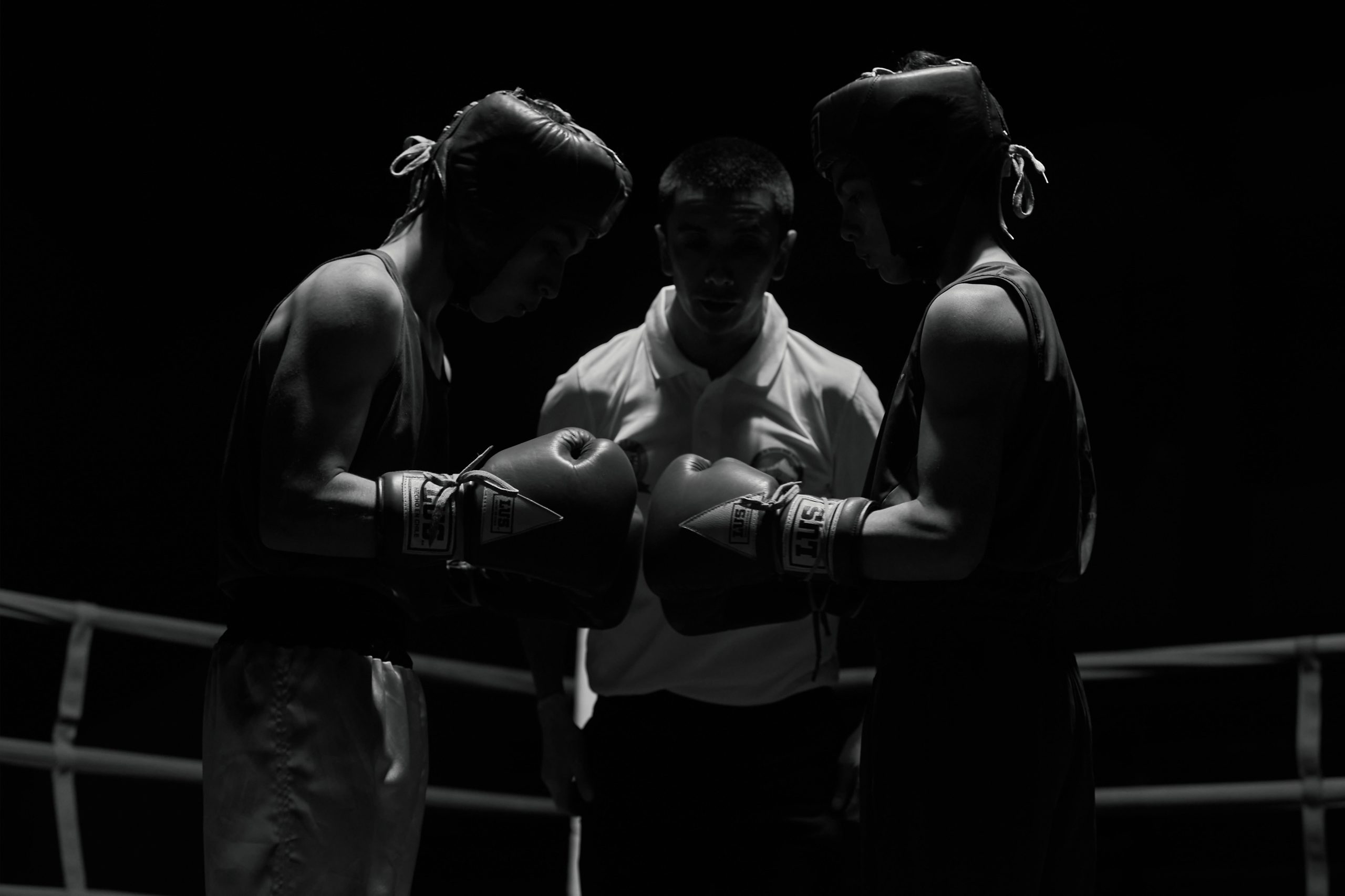 Two boxers standing in a ring