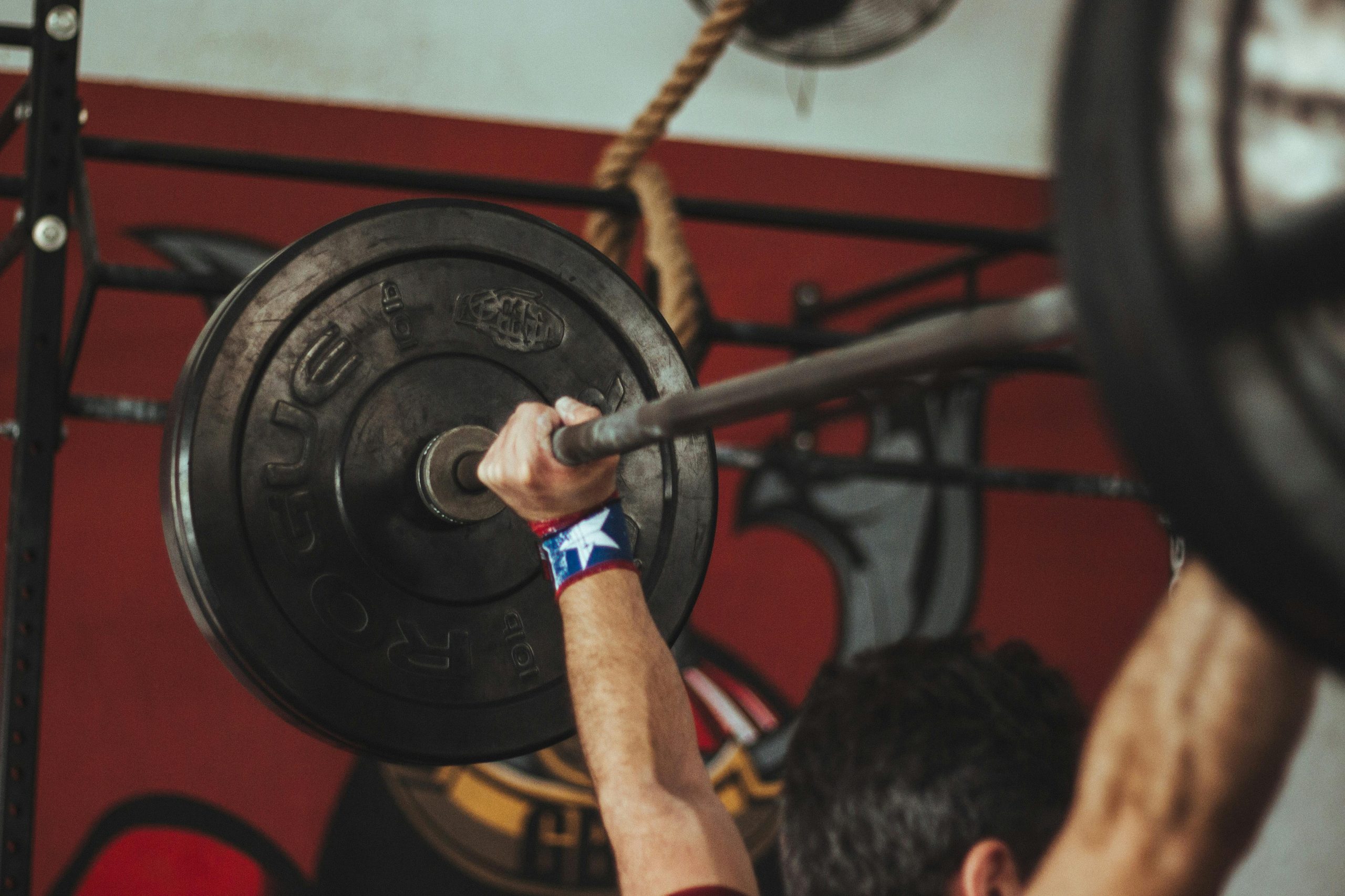 Man holding weights above his head