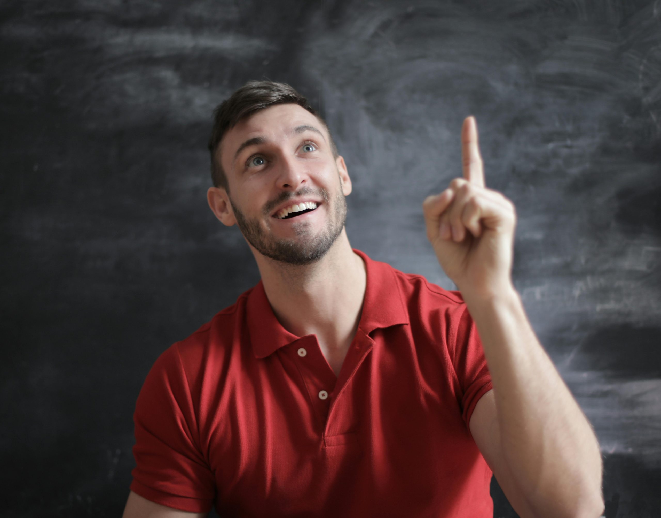 Person holding hand in the air excited